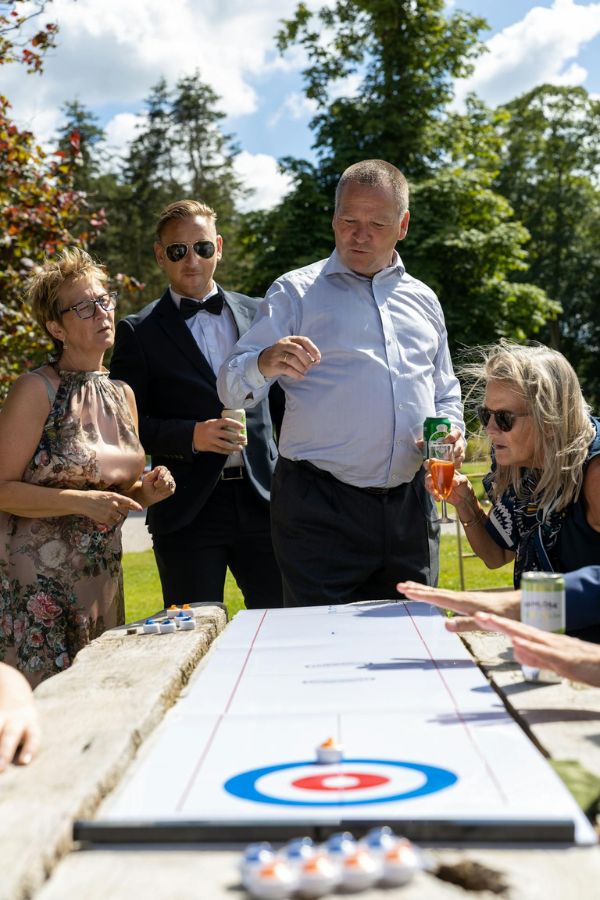 Adults gathered at an outdoor celebration.